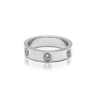 A silver metal ring studded with cubic zirconia gems.