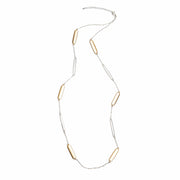 A long necklace chain with alternating gold and silver rectangular stations.