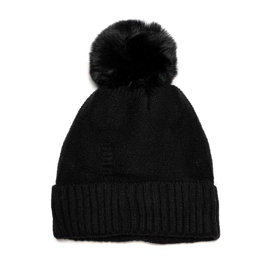A black knit hat with black faux fur pompom.