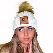 Model wearing the cream cable knit beanie.