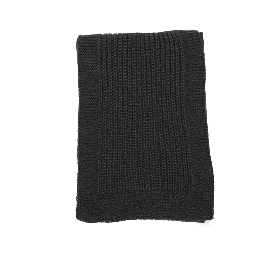 A grey knit scarf with knit border.