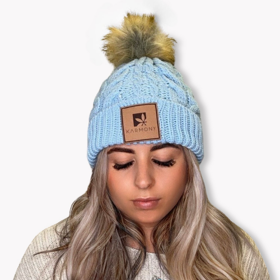 Model wearing sky blue frosted beanie.
