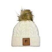 Cream cable knit beanie with faux fur pompom.