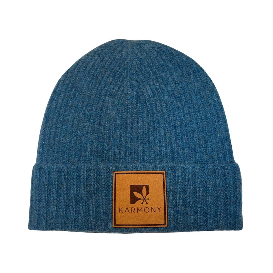 Cobalt cashmere beanie with square Karmony logo leather brim patch.