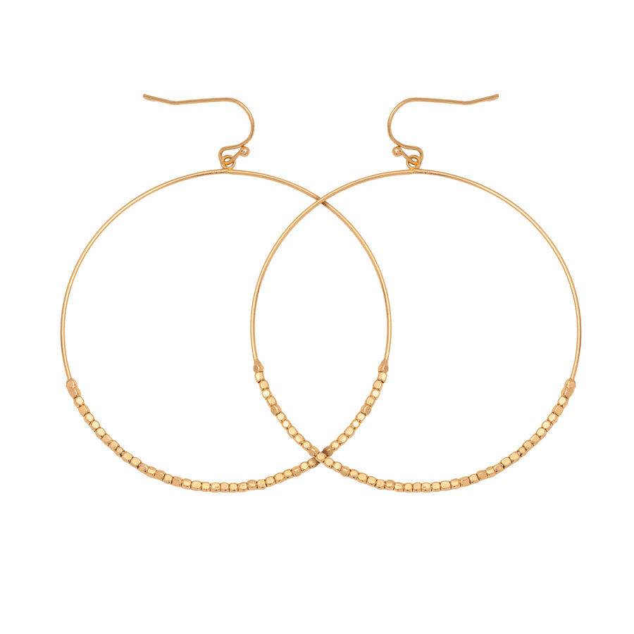 Gold drop earrings. The drops are hoops with seed beads on the lower half.