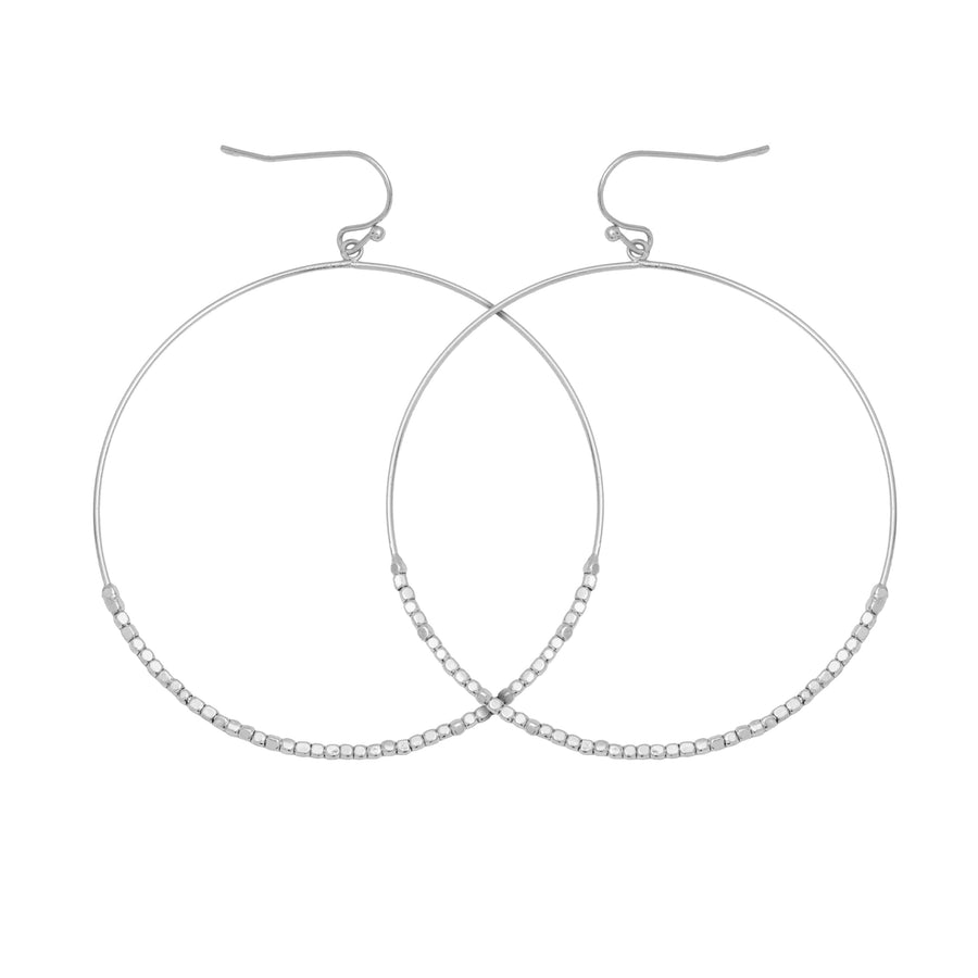 Silver drop earrings. The drops are hoops with seed beads on the lower half.