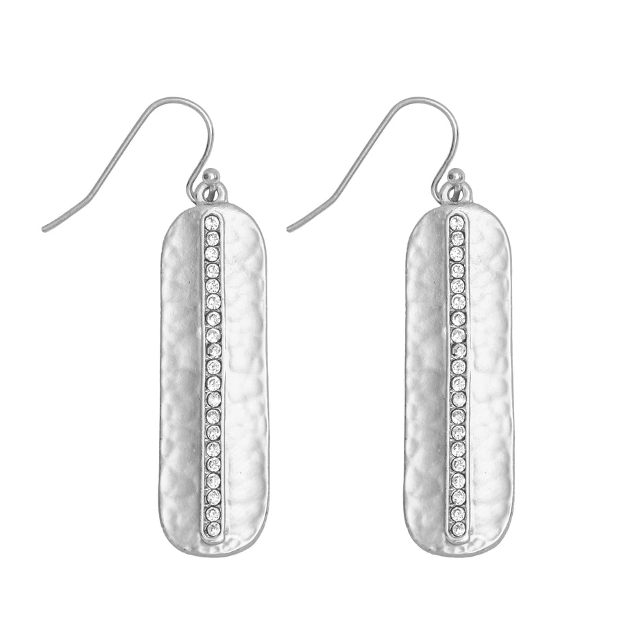 Matte silver capsule shaped Pave Drop Earring with hammered finish centered with row of imitation diamonds on white background