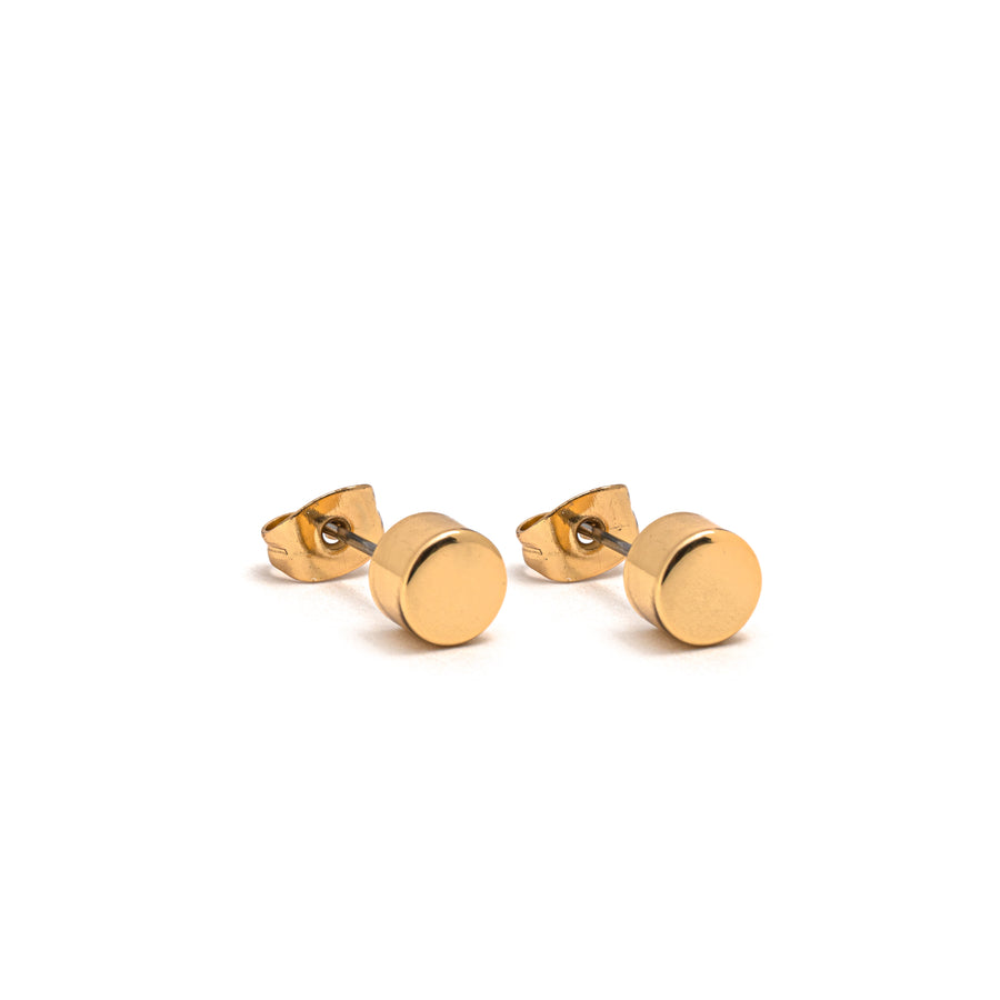 A pair of polished gold cylinder stud earrings.