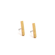 Brushed gold bar stud earrings.