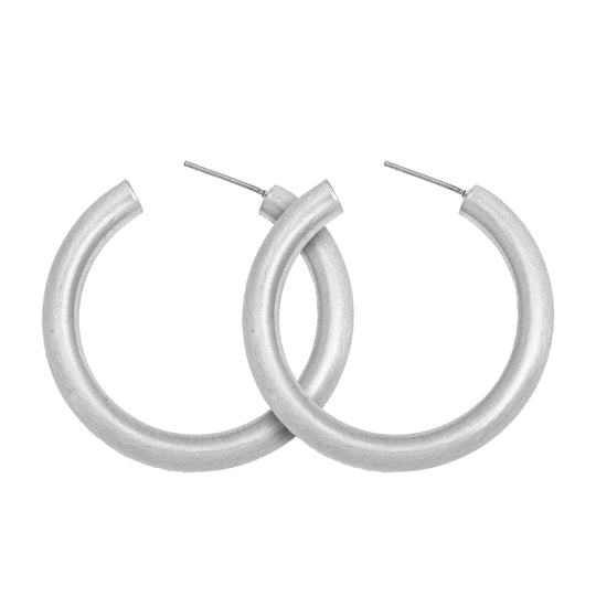 Medium sized matte silver rounded Satin Hoop Earring with stud back on white background