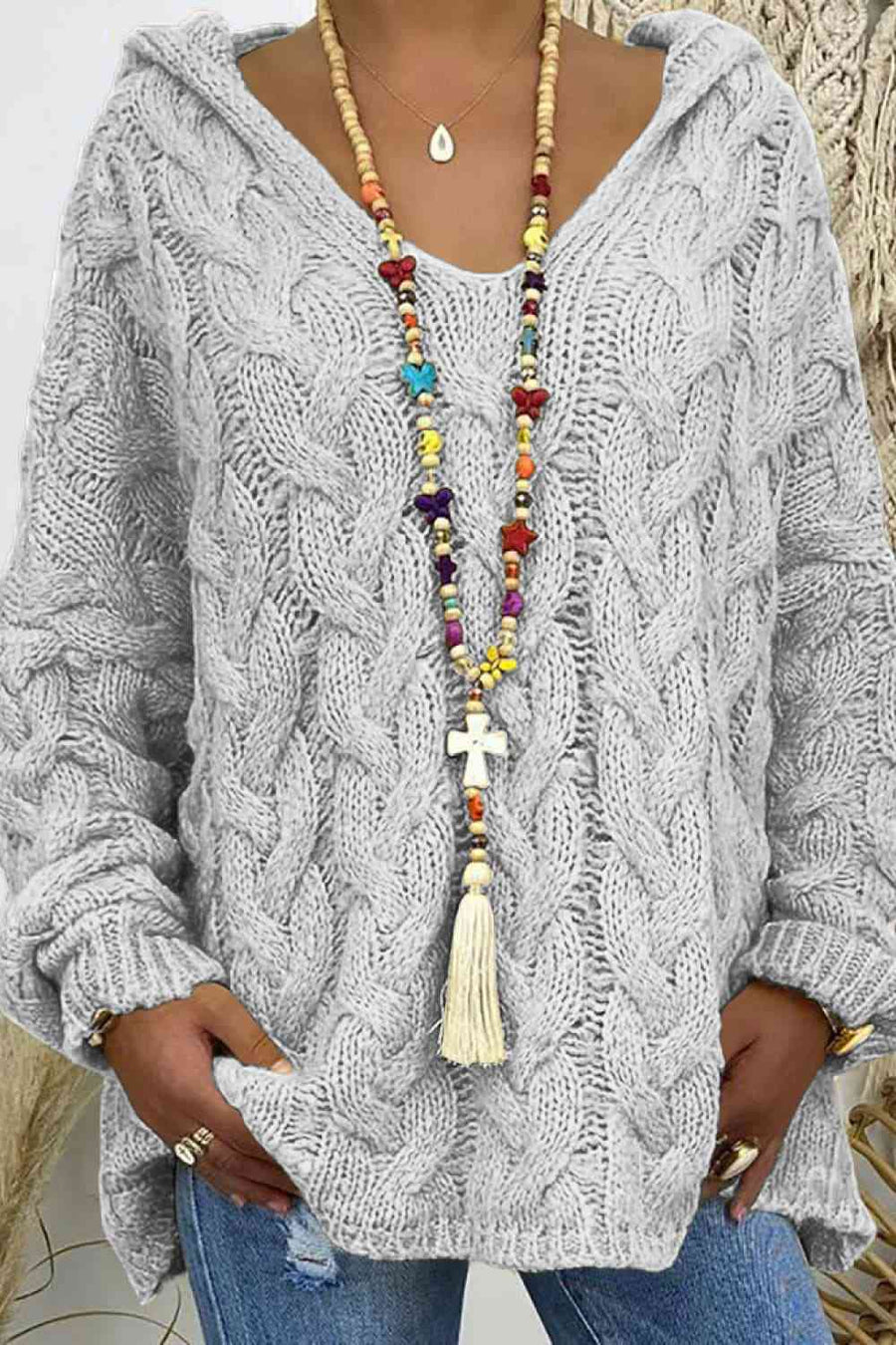 Light grey chunky cable knit hooded sweater.