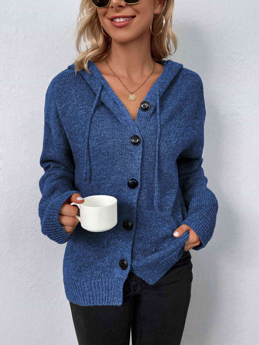 A marled denim blue, knit sweater with a drawstring hood and large black buttons.