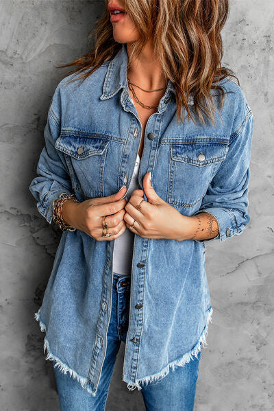 A blue, distressed denim shirt jacket with a raw hem.