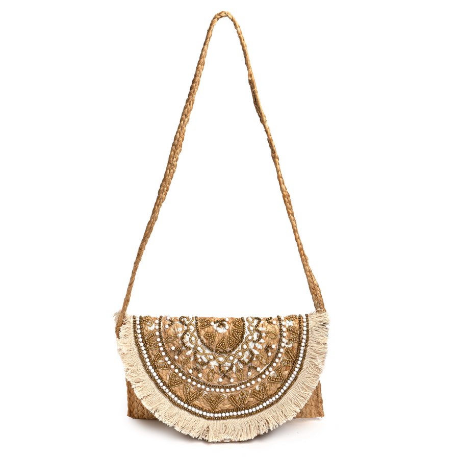 Envelope clutch made of jute, with white and brass beading and off-white fringe, and a braided cross-body strap.