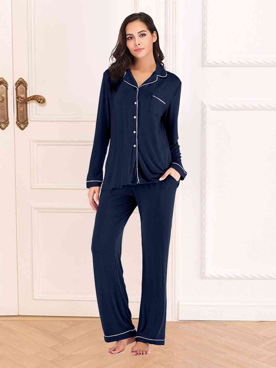 Navy pajama pants and button down top. Features white piping and breast pocket.