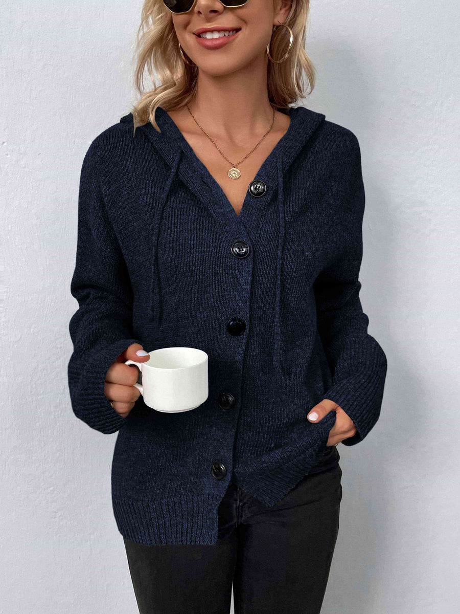 A marled navy, knit sweater with a drawstring hood and large black buttons.