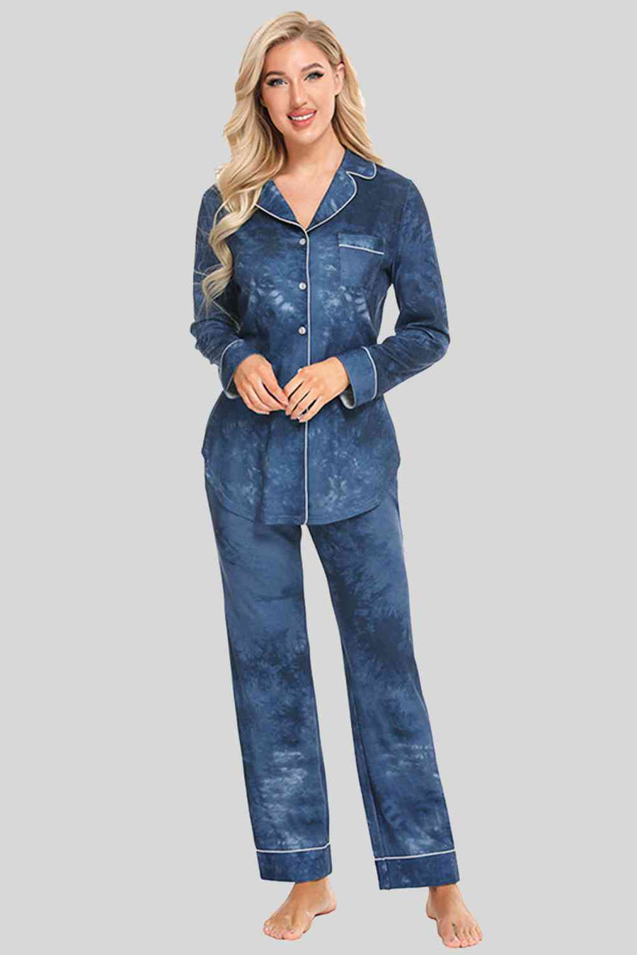 Blue washed pajama pants and button down top. Features white piping and breast pocket.