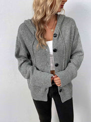 A marled grey, knit sweater with a drawstring hood and large black buttons.
