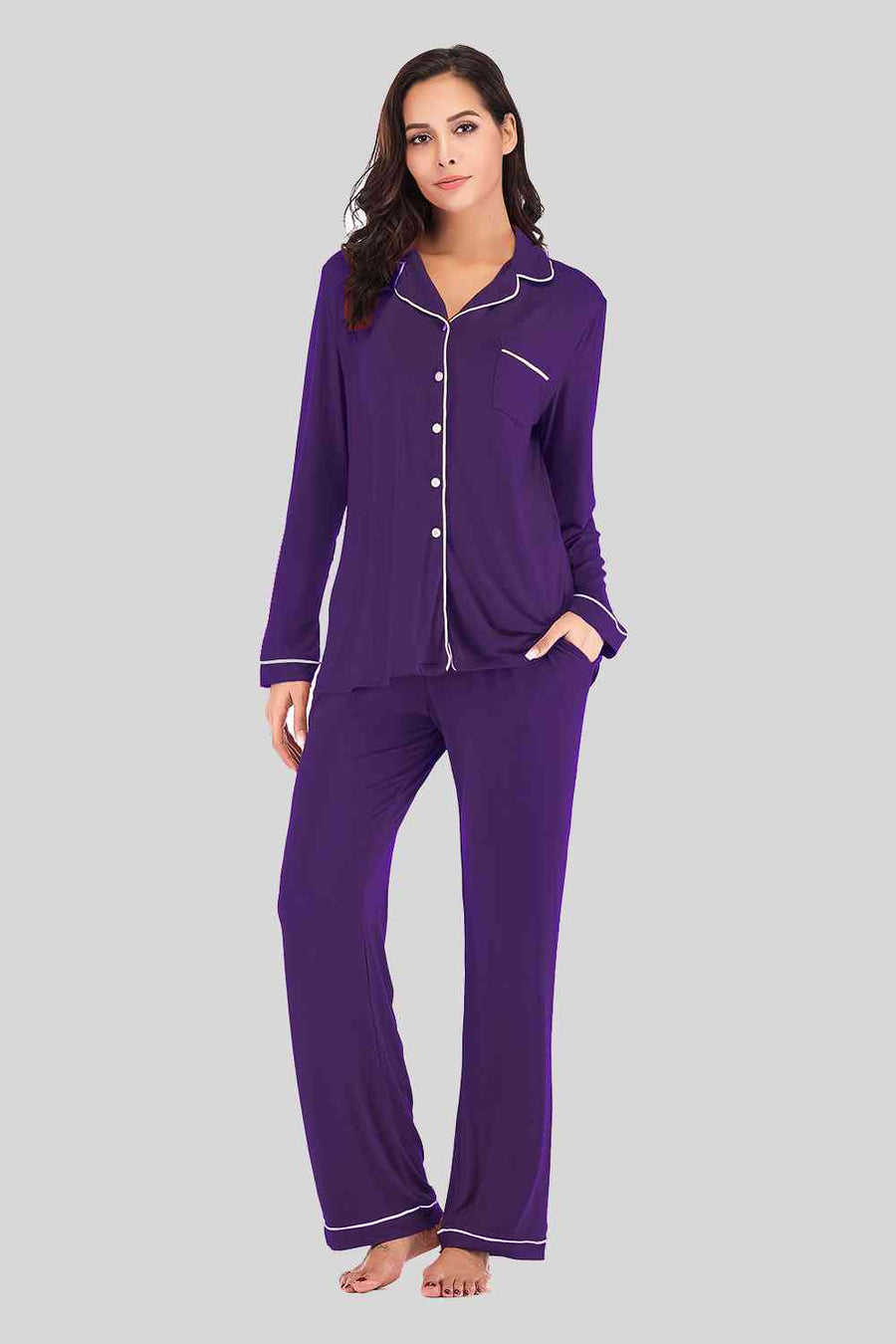 Violet pajama pants and button down top. Features white piping and breast pocket.