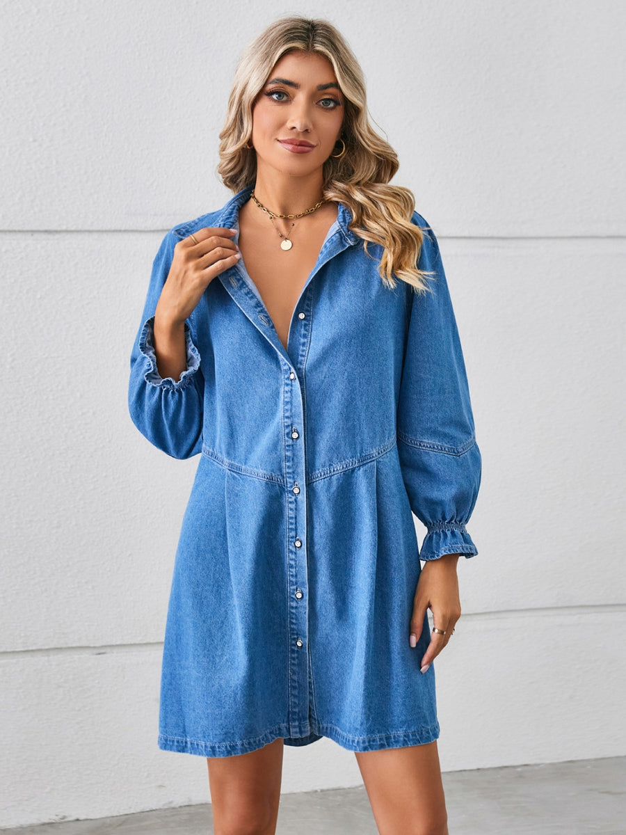 A midi length, button down, light denim dress with ruched sleeve cuffs.