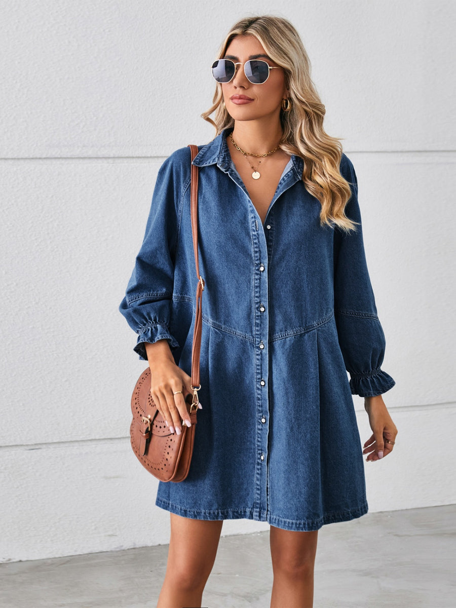 A midi length, button down, dark denim dress with ruched sleeve cuffs.