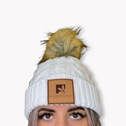 Model wearing cream frosted beanie.