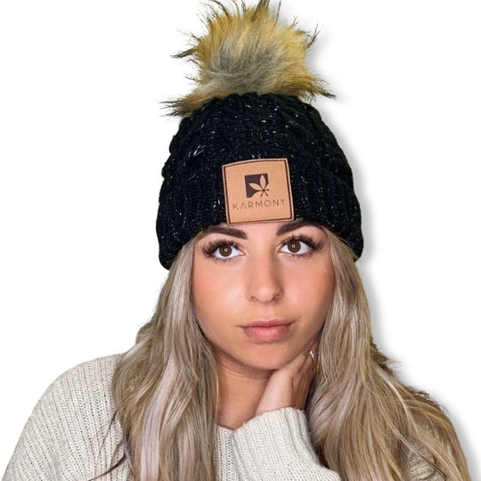 Model wearing black frosted beanie.