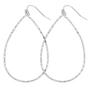 Minimalist and delicate matte finish open silver hammered Teardrop Earring with fish hook back on white background