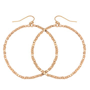 Matte Gold Beaded Nugget Hoop Earring with with fish hook back on white background 