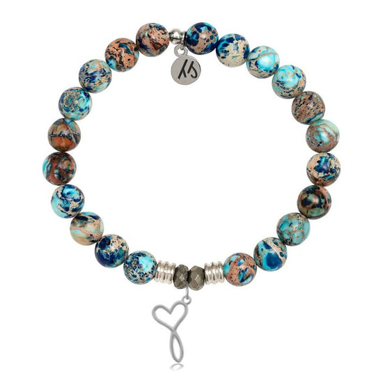 A T. Jazelle bracelet with a silver heart and infinity symbol combined charm and marbled blue-and-brown beads.