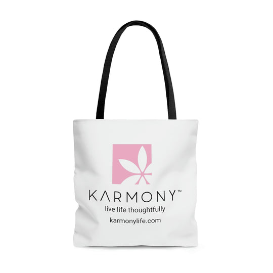 White Karmony branded tote bag with black straps on white background