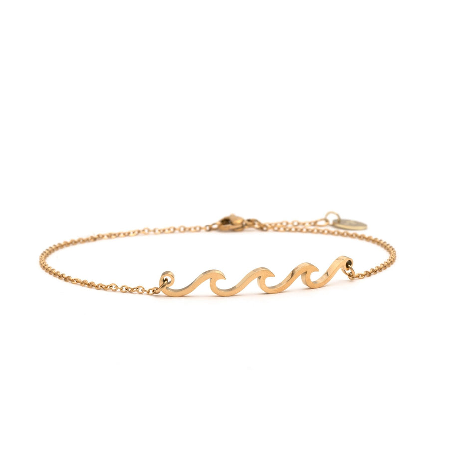 Polished gold Wave Anklet with chains attached on either side of a sequence of 3 waves with lobster claw hook on white background