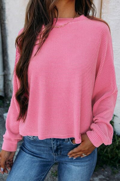 Longsleeve blouse with thin pink and white horizontal stripes.