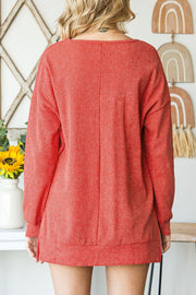 Back of red sweater, seam from collar to hem.